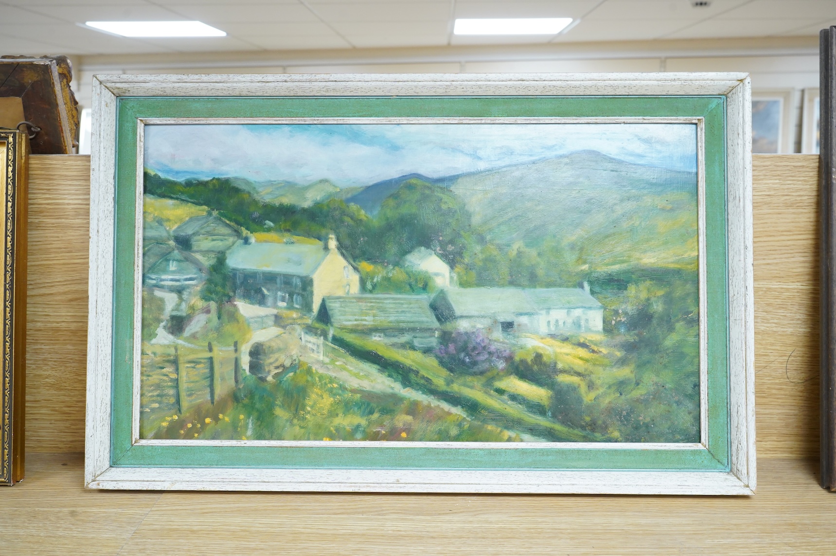 Attributed to Thelma Tinker (20th. C), Mountainous landscape with farm buildings, unsigned, oil on board, 33 x 57cm